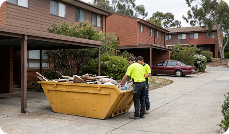 Skip Bin Hire Mawson team inspecting a full skip bin before waste collection and disposal