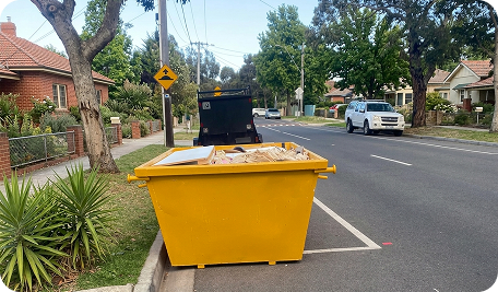 skip bin hire holt unit placed in front of a suburban home in Holt filled with household, garden, and renovation waste during a local clean-up