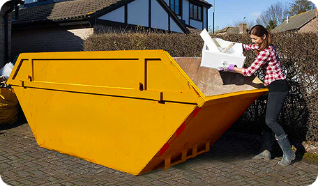 Homeowner filling a skip bin in Macquarie for household waste and clean-up