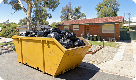 Full skip bin filled with household clutter, garden waste and renovation debris at a Conder residential property showing skip bin hire in Conder in use